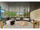 A screened porch with comfortable seating and neighborhood views, perfect for outdoor relaxation and entertaining guests at 130 Pier Pointe Dr., Little River, SC 29566