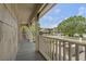 A covered porch boasts scenic views of neighboring properties, creating a serene outdoor living space at 130 Pier Pointe Dr., Little River, SC 29566