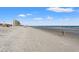 Scenic view of the sandy beach and ocean with a high-rise building in the background at 1330 Villa Marbella Ct. # 3-105, Myrtle Beach, SC 29572