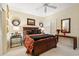Comfortable bedroom with a queen bed, stylish decorations, and ample natural light from the window at 1330 Villa Marbella Ct. # 3-105, Myrtle Beach, SC 29572