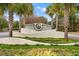 Elegant entrance sign framed by palm trees and manicured landscaping at 1330 Villa Marbella Ct. # 3-105, Myrtle Beach, SC 29572