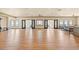Expansive event space featuring wood floors, neutral walls, ample natural light from the windows, and access to the balcony at 1330 Villa Marbella Ct. # 3-105, Myrtle Beach, SC 29572