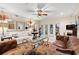 Well-decorated living room featuring a decorative ceiling fan and access to the porch at 1330 Villa Marbella Ct. # 3-105, Myrtle Beach, SC 29572