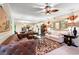 Bright living room featuring modern lighting, neutral walls, and rich leather couches at 1330 Villa Marbella Ct. # 3-105, Myrtle Beach, SC 29572