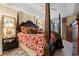 Elegant main bedroom with a four-poster bed, stylish decor, and natural light from the large windows at 1330 Villa Marbella Ct. # 3-105, Myrtle Beach, SC 29572