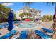 Beautiful pool area with a mushroom fountain, palm trees, lounge chairs, and a jacuzzi at 1330 Villa Marbella Ct. # 3-105, Myrtle Beach, SC 29572