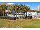 Inviting pool area surrounded by palm trees, umbrellas, and comfortable lounge chairs at 1330 Villa Marbella Ct. # 3-105, Myrtle Beach, SC 29572