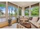 Cozy sunroom with lots of sunlight, tile floors, and wicker furnishings at 1330 Villa Marbella Ct. # 3-105, Myrtle Beach, SC 29572