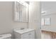 Bathroom features a vanity with white cabinets, mirror, and neutral walls at 1391 Turkey Ridge Rd. # C, Surfside Beach, SC 29575