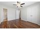 Bedroom with wood-look floors and adjacent bath access at 1391 Turkey Ridge Rd. # C, Surfside Beach, SC 29575