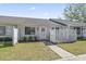 Charming condo featuring a front yard with a white picket fence and beautiful landscaping at 1391 Turkey Ridge Rd. # C, Surfside Beach, SC 29575
