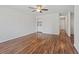 Large living room featuring hardwood floors, a ceiling fan, and a wet bar with crisp white cabinetry at 1391 Turkey Ridge Rd. # C, Surfside Beach, SC 29575