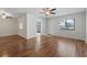 Open living room featuring wood floors, natural light, and easy access to the kitchen and entryway at 1391 Turkey Ridge Rd. # C, Surfside Beach, SC 29575