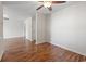 The living room has hardwood floors, ceiling fan, and large open space at 1391 Turkey Ridge Rd. # C, Surfside Beach, SC 29575