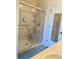 Bathroom showcasing a luxurious marble tiled shower with glass doors and a bench at 140 Zinnia Dr., Myrtle Beach, SC 29579