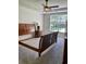 Bright bedroom with a large window, ceiling fan, and carpeted floors at 140 Zinnia Dr., Myrtle Beach, SC 29579