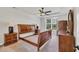 Well-lit bedroom with ceiling fan and large windows overlooking the yard at 140 Zinnia Dr., Myrtle Beach, SC 29579
