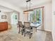 Dining room with large window and light fixture. The room is open to the kitchen and living room at 140 Zinnia Dr., Myrtle Beach, SC 29579