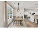 Dining area featuring an open layout to the kitchen and a large window providing abundant natural light at 140 Zinnia Dr., Myrtle Beach, SC 29579