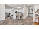 Open kitchen with granite countertops, white cabinets, stainless appliances, and breakfast bar seating at 140 Zinnia Dr., Myrtle Beach, SC 29579