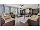 Cozy living room with hardwood floors, recliner seating, and large windows at 140 Zinnia Dr., Myrtle Beach, SC 29579