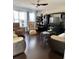 Cozy living room with hardwood floors, comfortable seating, and a large entertainment center at 140 Zinnia Dr., Myrtle Beach, SC 29579