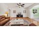Cozy living room with hardwood floors, comfortable seating, and a fireplace for a relaxed atmosphere at 140 Zinnia Dr., Myrtle Beach, SC 29579