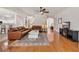 Spacious living room with hardwood floors, ceiling fan, and comfortable leather sofas at 140 Zinnia Dr., Myrtle Beach, SC 29579