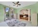 Light-filled sunroom leading into living room and outdoor patio area at 140 Zinnia Dr., Myrtle Beach, SC 29579