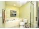 Bright bathroom features a jacuzzi tub with tile floors and a glass enclosed shower at 1401 Lighthouse Dr. # 4226, North Myrtle Beach, SC 29582