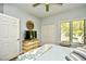 This bedroom includes a ceiling fan, natural light, and closet for storage at 1401 Lighthouse Dr. # 4226, North Myrtle Beach, SC 29582
