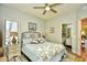 This bedroom boasts a king bed with a ceiling fan and ensuite bathroom at 1401 Lighthouse Dr. # 4226, North Myrtle Beach, SC 29582