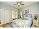 This bedroom offers a ceiling fan, natural light and a king bed with nautical bedding at 1401 Lighthouse Dr. # 4226, North Myrtle Beach, SC 29582