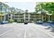 View of the condominiums with parking and landscaped grounds at Lighthouse Point Villas at 1401 Lighthouse Dr. # 4226, North Myrtle Beach, SC 29582