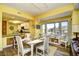 Dining area features a white table with view to the outside and open to the kitchen at 1401 Lighthouse Dr. # 4226, North Myrtle Beach, SC 29582