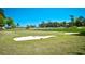 Scenic golf course view with sand trap and green against a bright blue sky at 1401 Lighthouse Dr. # 4226, North Myrtle Beach, SC 29582