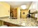Kitchen counter with sink, faucet, white cabinets, and granite countertops at 1401 Lighthouse Dr. # 4226, North Myrtle Beach, SC 29582