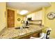 Kitchen counter with sink, faucet, white cabinets, and granite countertops at 1401 Lighthouse Dr. # 4226, North Myrtle Beach, SC 29582