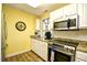 Bright kitchen with stainless steel appliances, granite counters, and white cabinets at 1401 Lighthouse Dr. # 4226, North Myrtle Beach, SC 29582