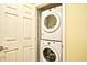 Laundry closet with a stacked washer and dryer behind a bi-fold door at 1401 Lighthouse Dr. # 4226, North Myrtle Beach, SC 29582