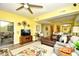 Bright living room with wood floors, ceiling fan and sliding glass doors to patio at 1401 Lighthouse Dr. # 4226, North Myrtle Beach, SC 29582