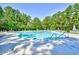 Large outdoor swimming pool surrounded by trees and lounge chairs, perfect for relaxation at 1401 Lighthouse Dr. # 4226, North Myrtle Beach, SC 29582