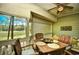 Screened in porch with table and chairs and a view of a golf course at 1401 Lighthouse Dr. # 4226, North Myrtle Beach, SC 29582