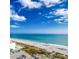 Breathtaking aerial view of the sandy beach, with people and cars, and clear ocean at 1501 S Ocean Blvd. # 1009, Myrtle Beach, SC 29577