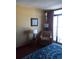 Relaxing bedroom with a sitting chair and sliding glass doors to a balcony at 1501 S Ocean Blvd. # 1009, Myrtle Beach, SC 29577