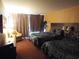 Comfortable room with two queen beds, bedside lamps, and a balcony at 1501 S Ocean Blvd. # 1009, Myrtle Beach, SC 29577