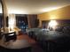 Comfortable room with two queen beds, bedside lamps, and a balcony at 1501 S Ocean Blvd. # 1009, Myrtle Beach, SC 29577