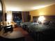 Comfortable room with two queen beds, bedside lamps, and a balcony at 1501 S Ocean Blvd. # 1009, Myrtle Beach, SC 29577
