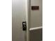 Secured door with keyless entry system and clear unit number signage, offering convenience at 1501 S Ocean Blvd. # 1009, Myrtle Beach, SC 29577