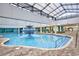 Bright indoor pool area with a fountain, ample seating, and clear, inviting water at 1501 S Ocean Blvd. # 1009, Myrtle Beach, SC 29577